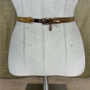 Vintage 1980’s women’s designer Motion East metal stretch belts S-M 30-34 inch